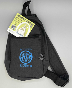 Teens Summer Reading 2021 Prize. Sling Bag with Library Logos and Commemorative Sticker.